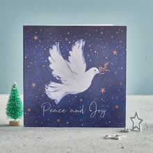 Load image into Gallery viewer,  A Christmas card with a dove on the front, flying in the night sky. The text on the front of the card reads &#39;Peace and Joy&#39;