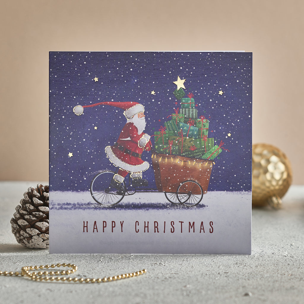 Special delivery Christmas cards that feature Santa on a bike. Text on the front of the card reads 'Happy Christmas'