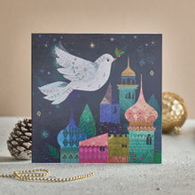 Load image into Gallery viewer, A Christmas card with a dove flying over a Bethlehem sky. 